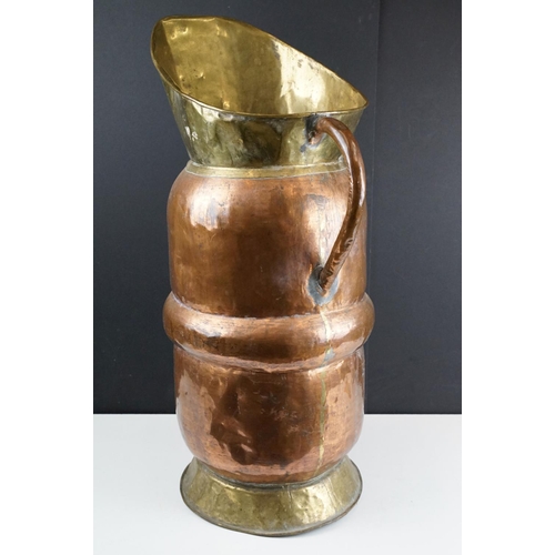 172 - Large Early 20th century Copper and Part Brass Stickstand in the form of a Jug, 66cm high