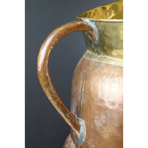 172 - Large Early 20th century Copper and Part Brass Stickstand in the form of a Jug, 66cm high