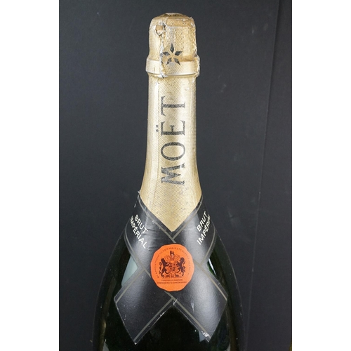 177 - Large Moet & Chandon champagne dummy bottle together with two smaller examples. Measures 68cm tall, ... 