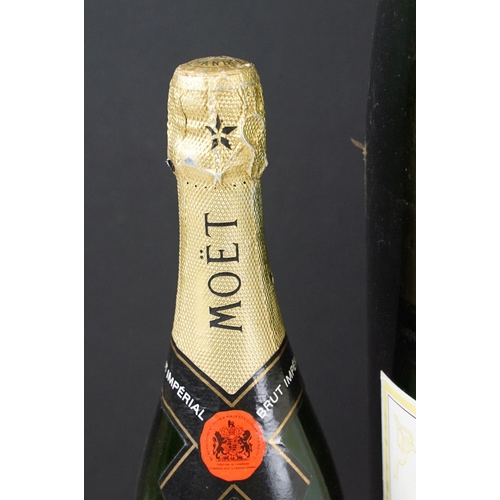 177 - Large Moet & Chandon champagne dummy bottle together with two smaller examples. Measures 68cm tall, ... 