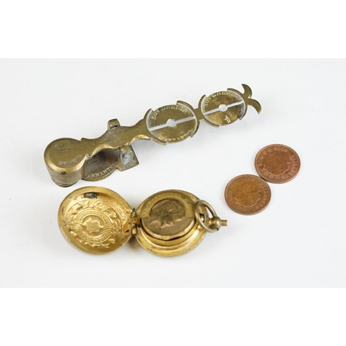 275 - A set of antique brass sovereign scales together with a sovereign holder.