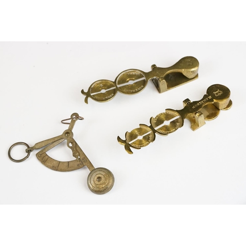 279 - Two sets of antique brass sovereign scales together with a set of balance scales.