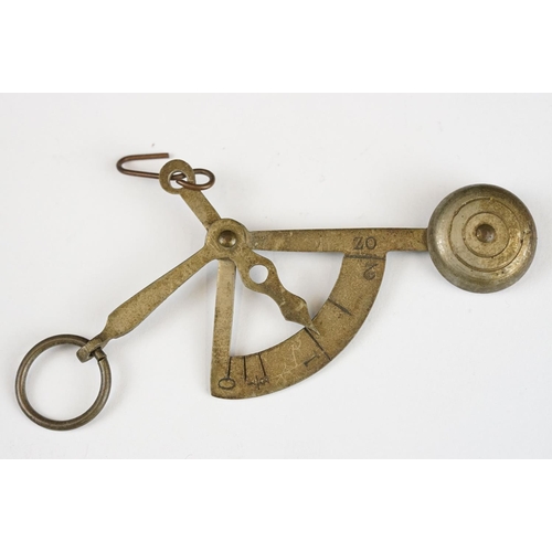 279 - Two sets of antique brass sovereign scales together with a set of balance scales.