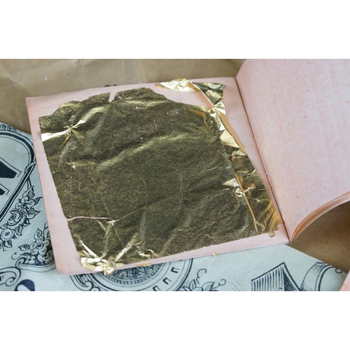 280 - A Quantity of gold leaf contained within paper envelopes.