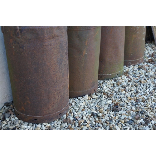 536 - Collection of four steel milk churns of typical form, two with lids. Measure approx 75cm tall