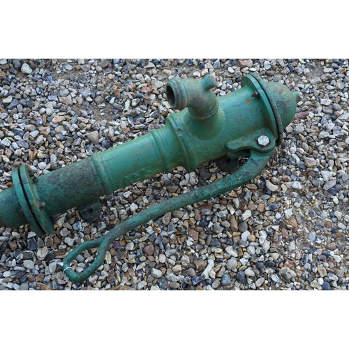 538 - Cast iron green painted water pump, together with a lead example