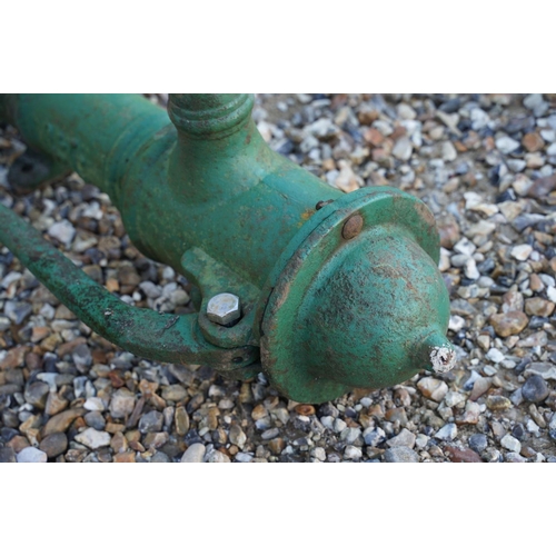 538 - Cast iron green painted water pump, together with a lead example