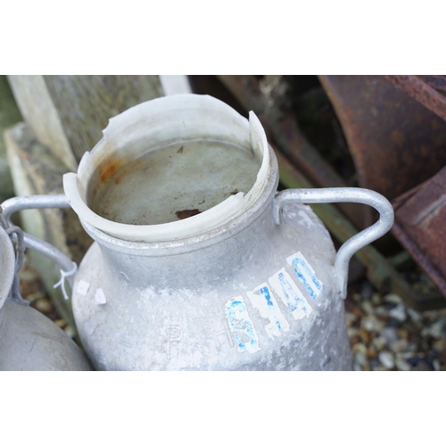 549 - Two aluminium milk churns, twin-handled, of typical form, approx 53cm high