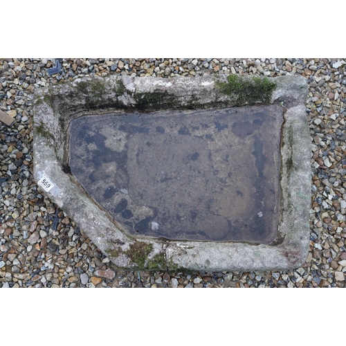 559 - Stone trough of irregular form, measures approx 75cm at widest point