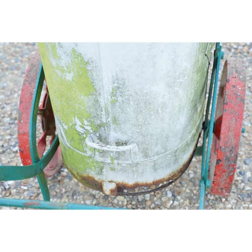 561 - Wrought iron trolley on cast iron wheels, with steel bucket, measures approx 120cm long