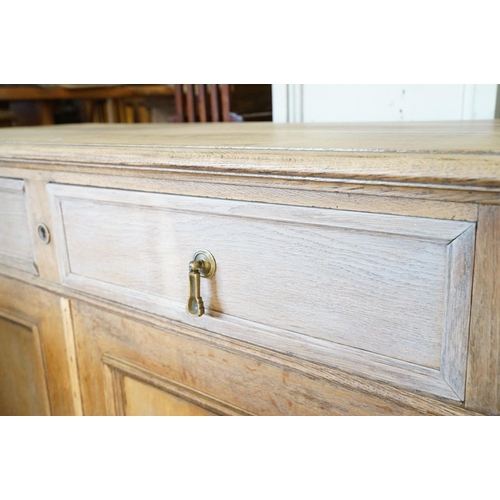 586 - Early 20th century Limed Oak Side Cabinet with two drawers over two cupboard doors, raised on squat ... 