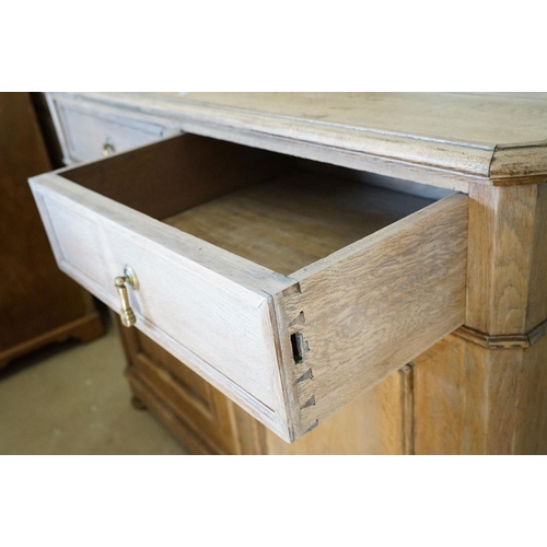 586 - Early 20th century Limed Oak Side Cabinet with two drawers over two cupboard doors, raised on squat ... 