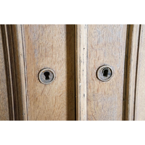 586 - Early 20th century Limed Oak Side Cabinet with two drawers over two cupboard doors, raised on squat ... 