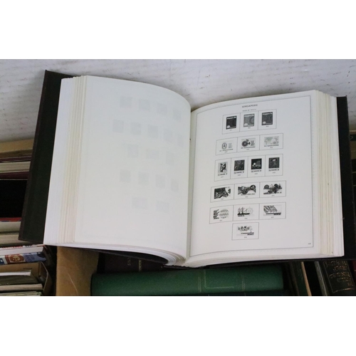 419 - Two boxes of empty stamp collectors albums, together with a collection of philatelic books and guide... 