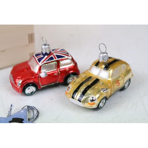 326 - A collection of Christmas ornaments to include glass baubles in the form of cars.