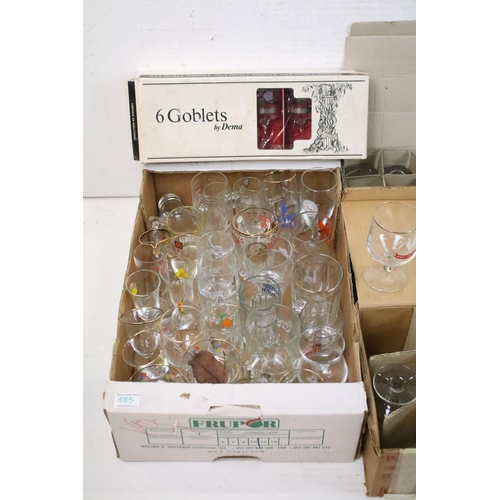 385 - A large collection of drinking glasses to include advertising examples contained within seven boxes.