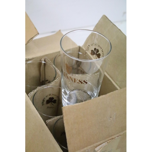 385 - A large collection of drinking glasses to include advertising examples contained within seven boxes.