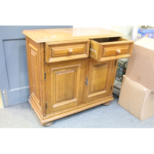 571 - German Oak Dresser Base or Side Cabinet with two drawers over two cupboard doors, raised on bun feet... 