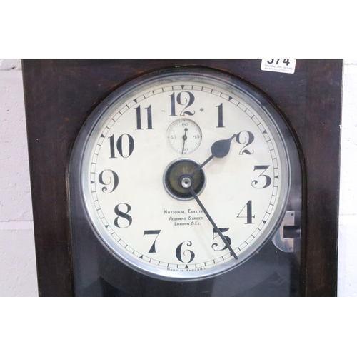 574 - Early 20th century National Electric Wooden Cased Wall Clock, the white enamel dial with Arabic nume... 