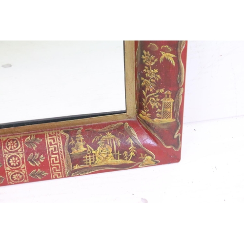 577 - Toleware Wall Mirror with Chinoiserie type decoration on a red ground, 101cm x 58cm