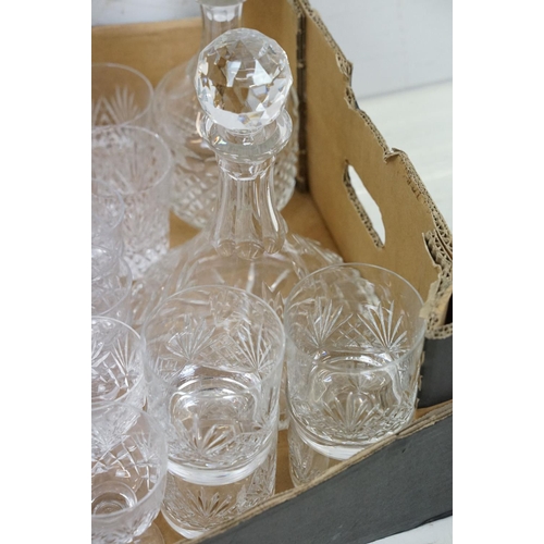 116 - Collection of cut crystal glass ware to include two decanters, tumblers, wine glasses, champagne, sh... 