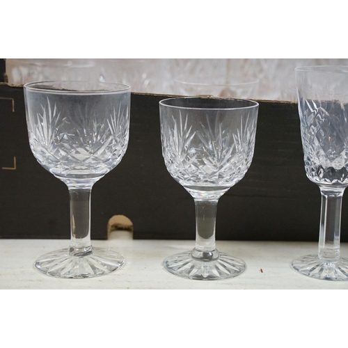 116 - Collection of cut crystal glass ware to include two decanters, tumblers, wine glasses, champagne, sh... 