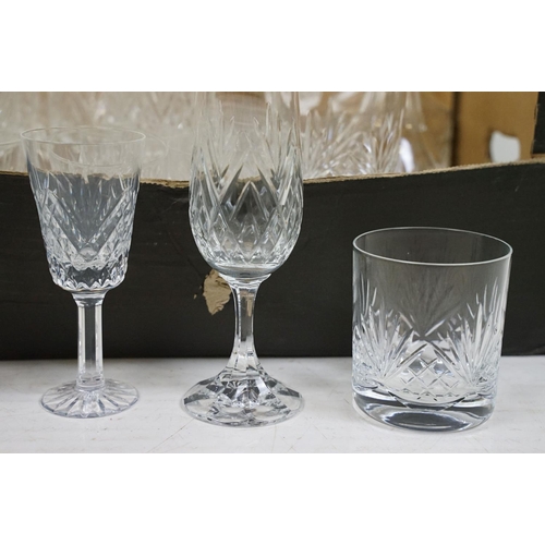 116 - Collection of cut crystal glass ware to include two decanters, tumblers, wine glasses, champagne, sh... 