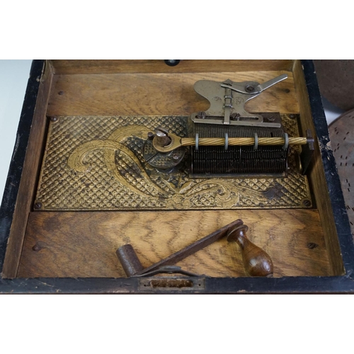 169 - Early 20th Century mahogany cased table top Kalliope music box playing 23cm discs, the lid interior ... 