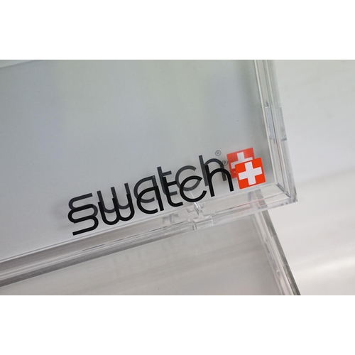 289 - A collection of Swatch watch perspex display cases.