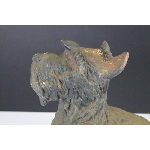 382A - Cast iron doorstop modelled as a Scottish Terrier dog, measures approx 29cm tall