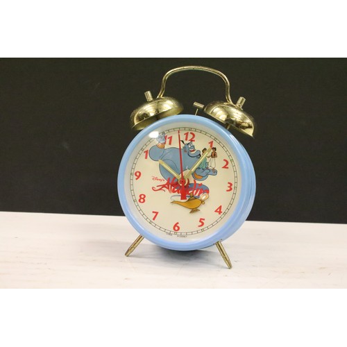 401A - A collection of three vintage wind up alarm clocks to include Micky Mouse and Aladin examples.