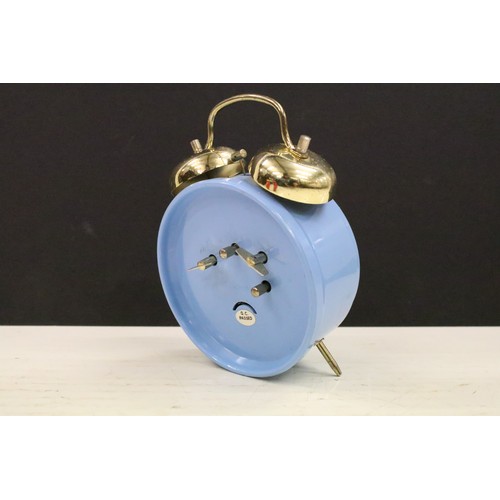 401A - A collection of three vintage wind up alarm clocks to include Micky Mouse and Aladin examples.