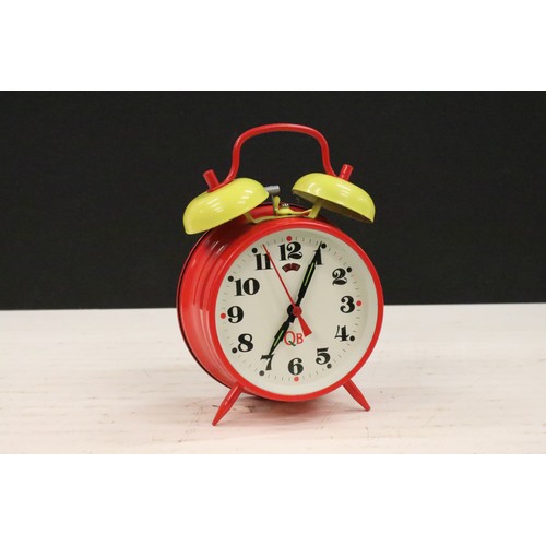 401A - A collection of three vintage wind up alarm clocks to include Micky Mouse and Aladin examples.