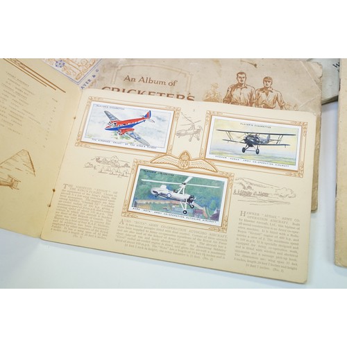 415A - Collection of postcards & cigarette cards, the cigarette cards contained within various albums (to i... 