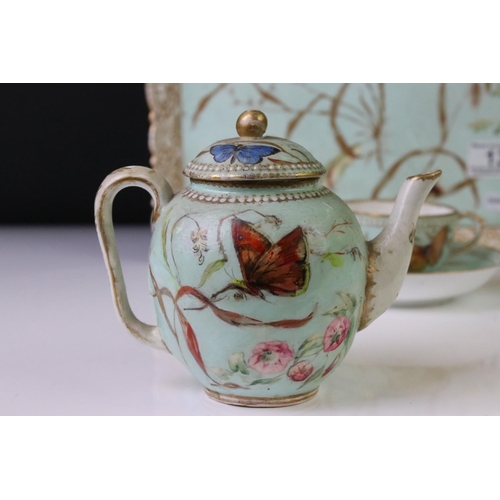 56 - Royal Worcester porcelain cabaret tea set with hand painted butterfly, floral and foliate decoration... 