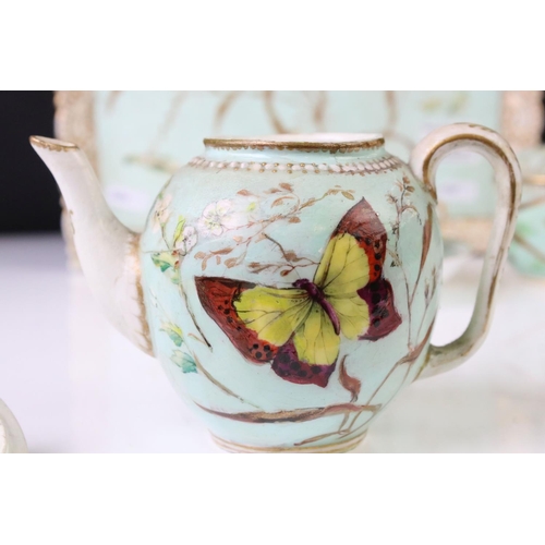 56 - Royal Worcester porcelain cabaret tea set with hand painted butterfly, floral and foliate decoration... 