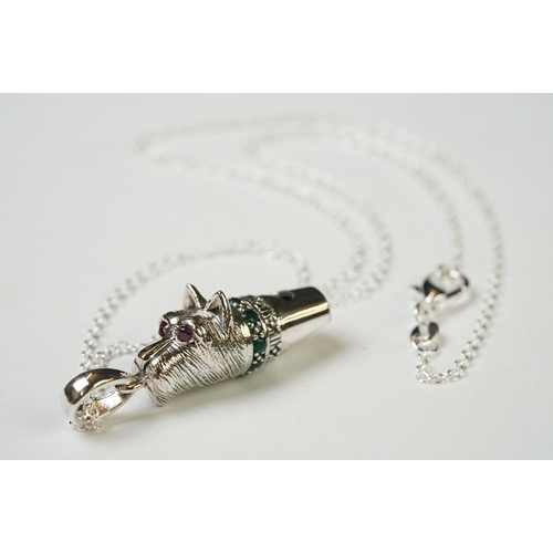 230 - Silver dog whistle with ruby eyes and emerald collar, on silver chain