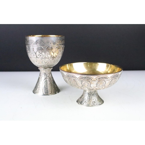 130 - Silver plated 'Last Supper' chalice & footed dish depicting the symbols of the four Evangelists, wit... 