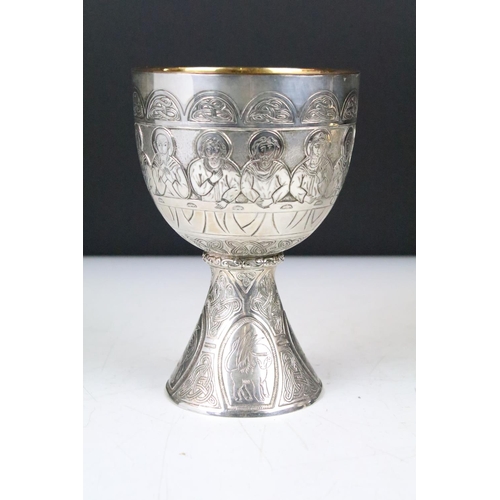 130 - Silver plated 'Last Supper' chalice & footed dish depicting the symbols of the four Evangelists, wit... 