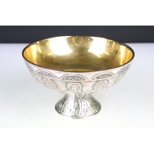 130 - Silver plated 'Last Supper' chalice & footed dish depicting the symbols of the four Evangelists, wit... 