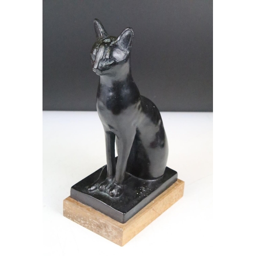 148 - Austin Prod - A 1960's bronzed resin sculpture of a seated cat, impressed 'Austin Prod Inc 1965', ra... 