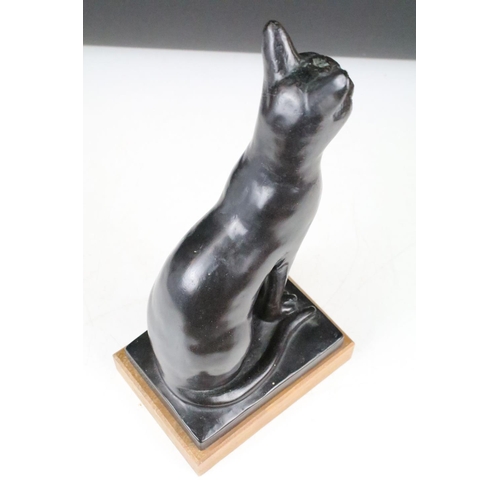 148 - Austin Prod - A 1960's bronzed resin sculpture of a seated cat, impressed 'Austin Prod Inc 1965', ra... 