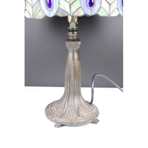 154 - Tiffany style table lamp with leaded glass shade & bronzed textured metal base, raised on four feet.... 