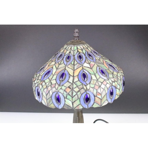 154 - Tiffany style table lamp with leaded glass shade & bronzed textured metal base, raised on four feet.... 