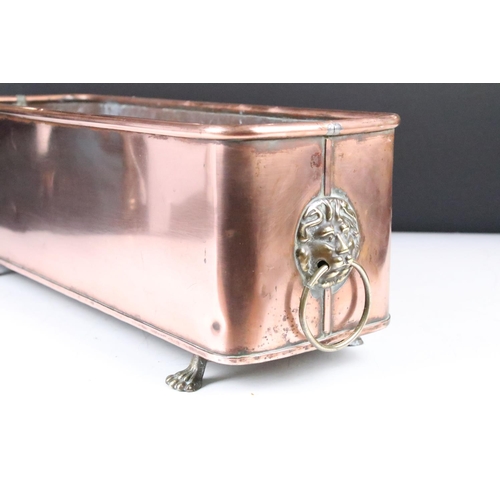 164 - Large Copper Planter of rectangular form with rounded corners and rolled edge, having a pair of lion... 