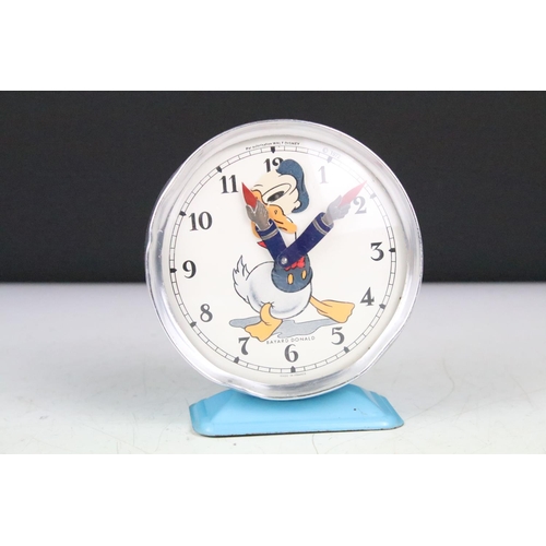 173 - Two vintage Walt Disney novelty wind up alarm clocks to include Mickey Mouse and Donald Duck