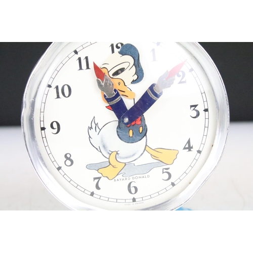 173 - Two vintage Walt Disney novelty wind up alarm clocks to include Mickey Mouse and Donald Duck