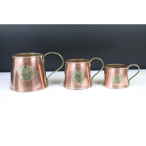 178 - Set of Three Antique Copper Ale Measuring Tankards or Mugs, each set with a brass roundel inscribed ... 