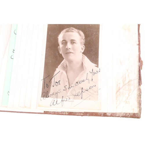 186 - An early to mid 20th century autograph album containing a good selection of celebrity autographs to ... 