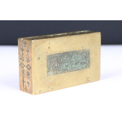 190 - An antique brass vesta box with chased decoration and cabochon settings to lid, strkier to base and ... 